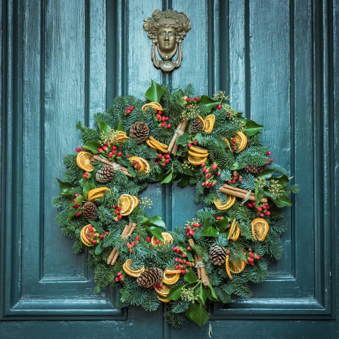 Christmas foliage wreath on door free stock photo