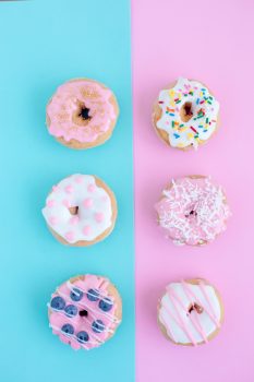 Doughnuts on turquoise and pink backgrounds