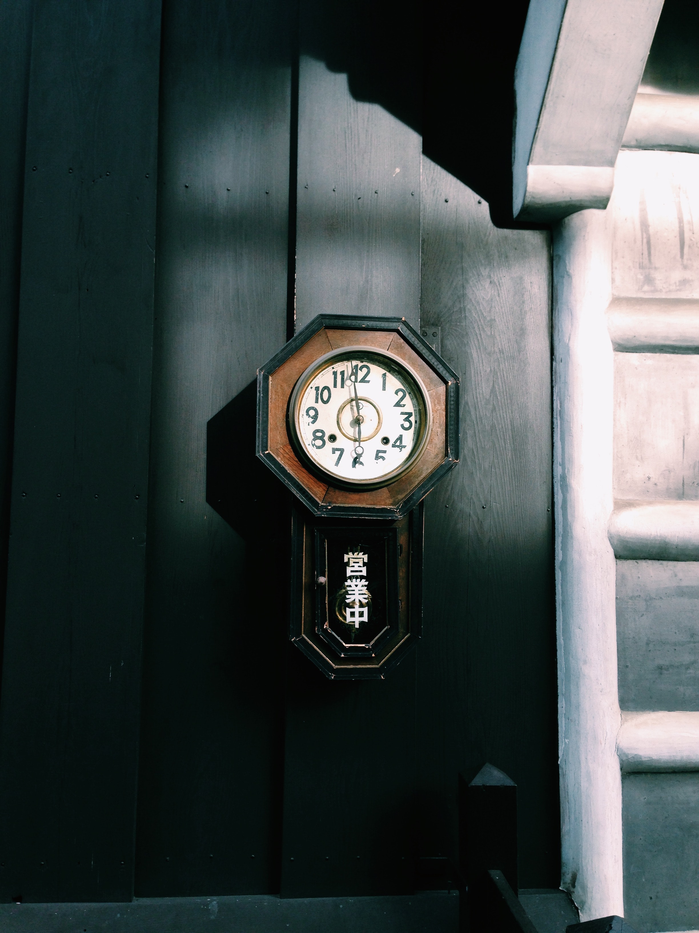 A photo of an antique analog wall clock