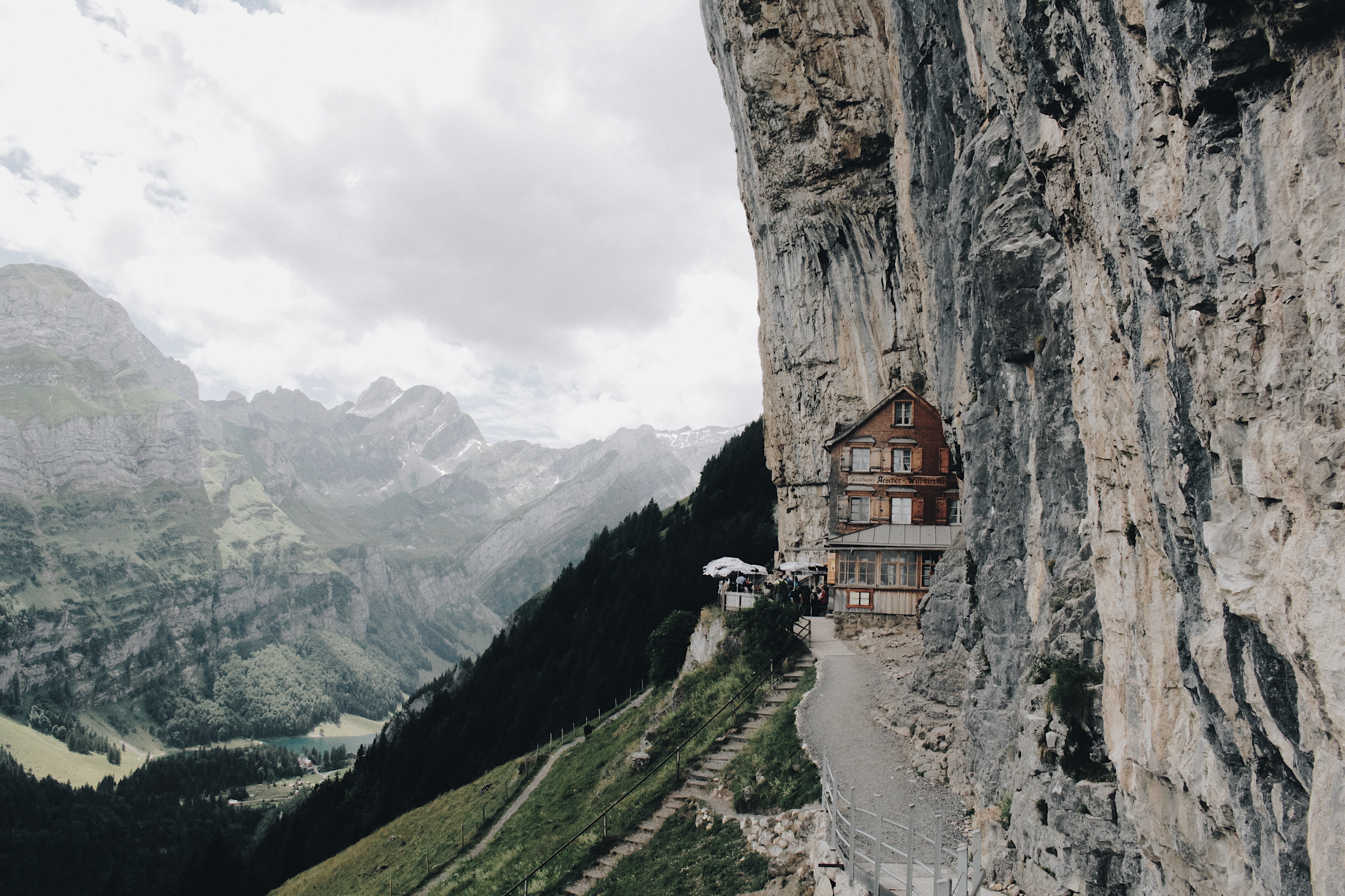 A restaurant on a mountainside during cloudy weather