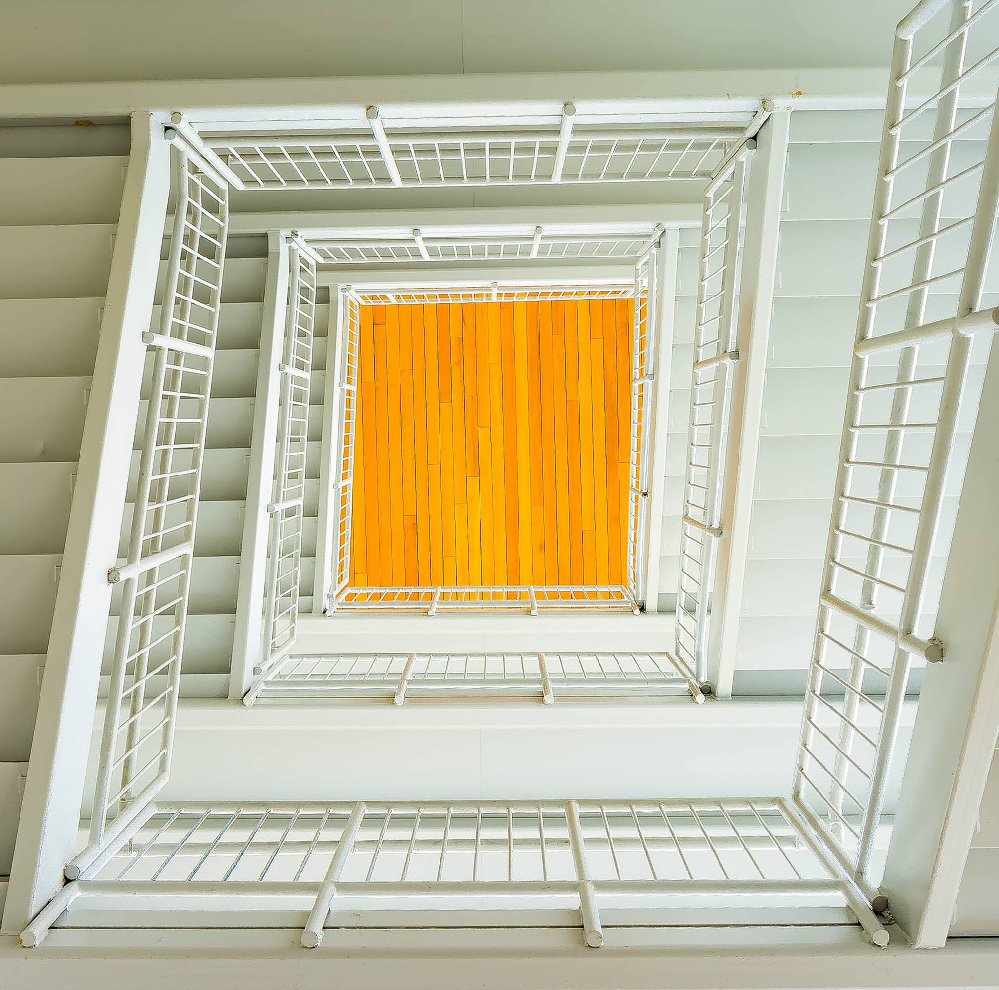 Photo of a white square spiral staircase