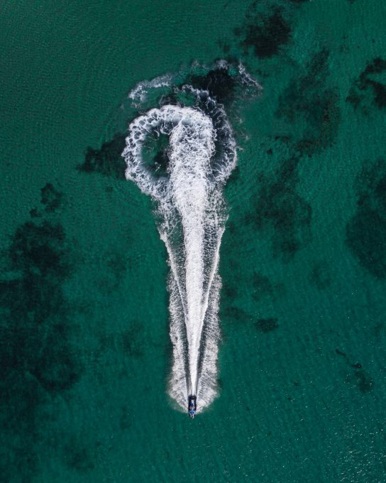 Aerial photo of a boat on the body of water