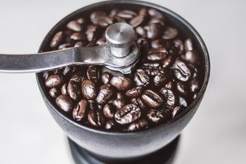Coffee beans in a coffee grinder