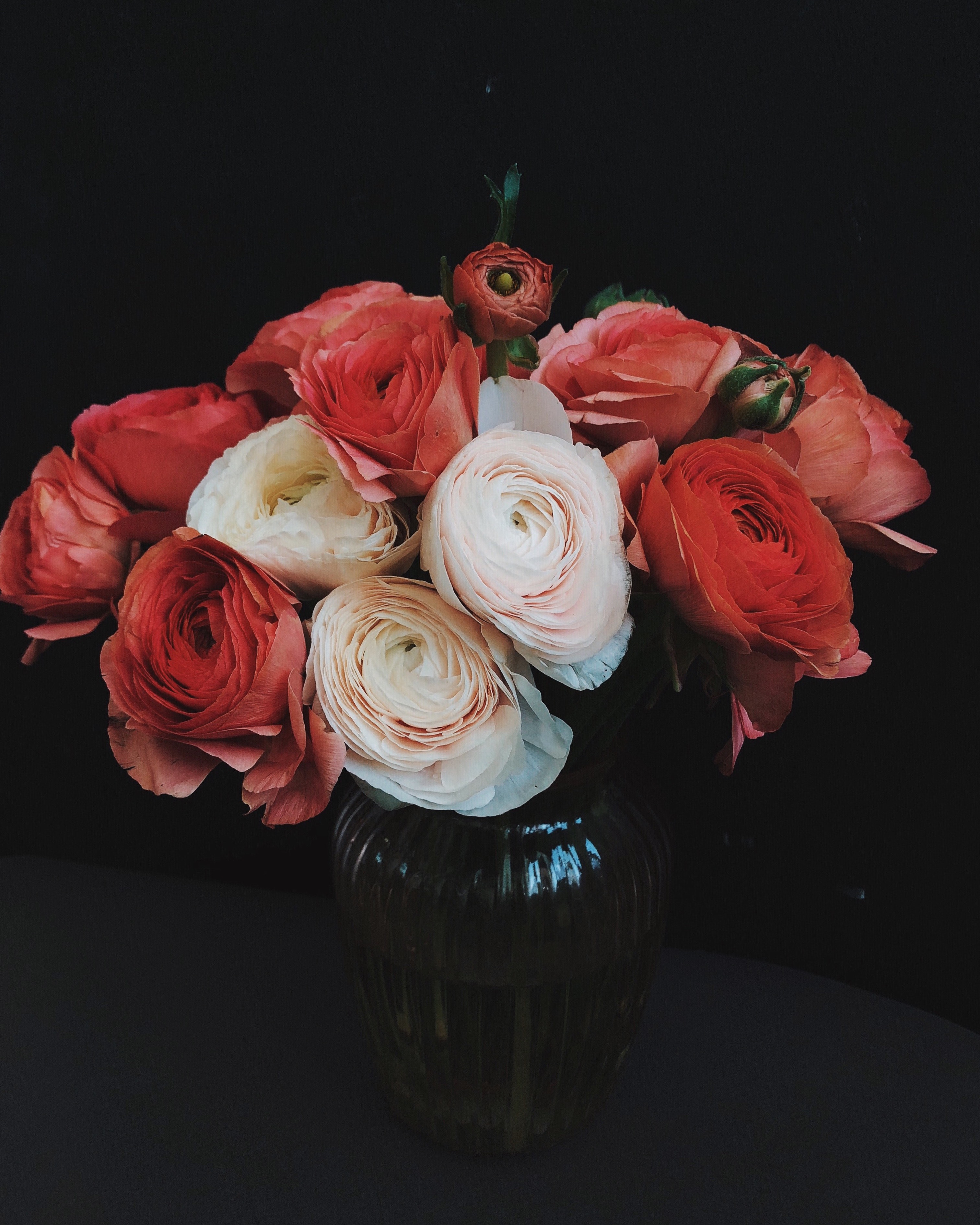 Photo of flowers in a vase on a dark background