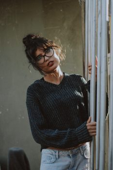 Photography of a woman wearing a gray corduroy sweater