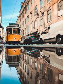 Reflection of a tram in a puddle