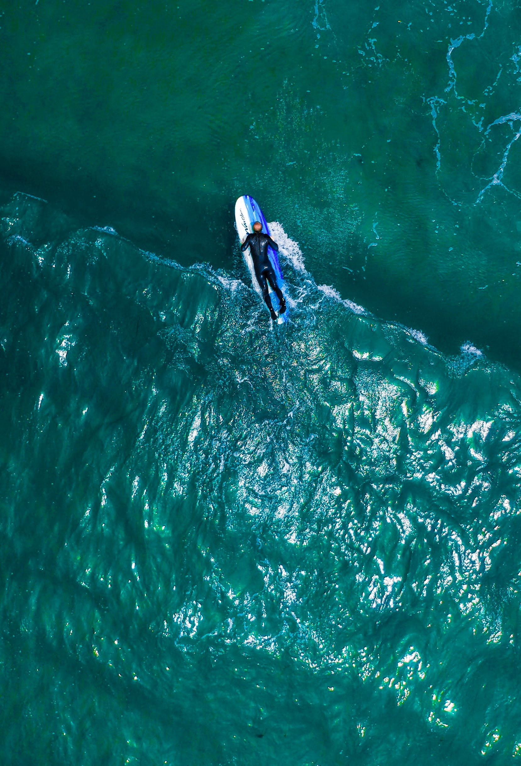 Aerial view of a person on a surfboard