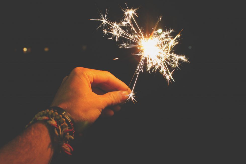 Photo of a person holding sparkler