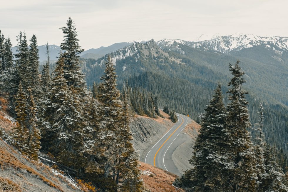 A gray asphalt road on a cliff