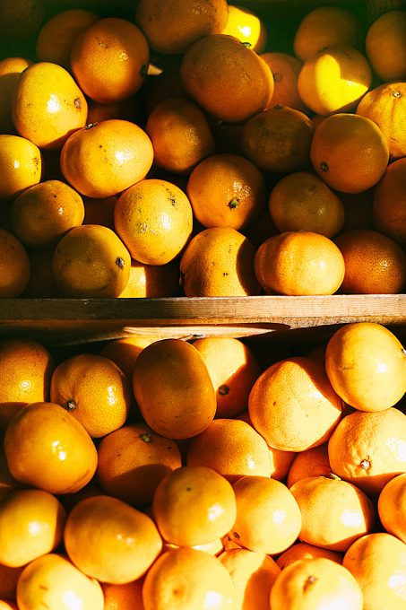Photo of a pile of orange fruits