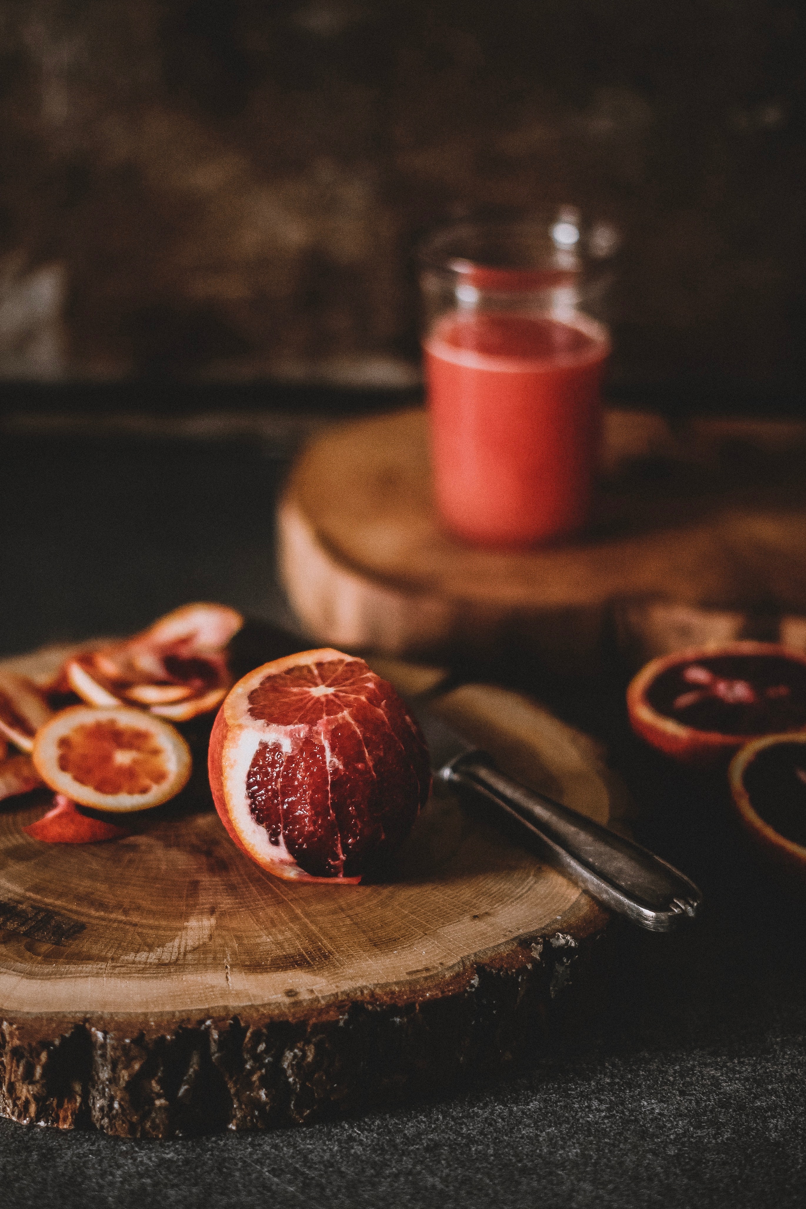 A grapefruit on a chopping board