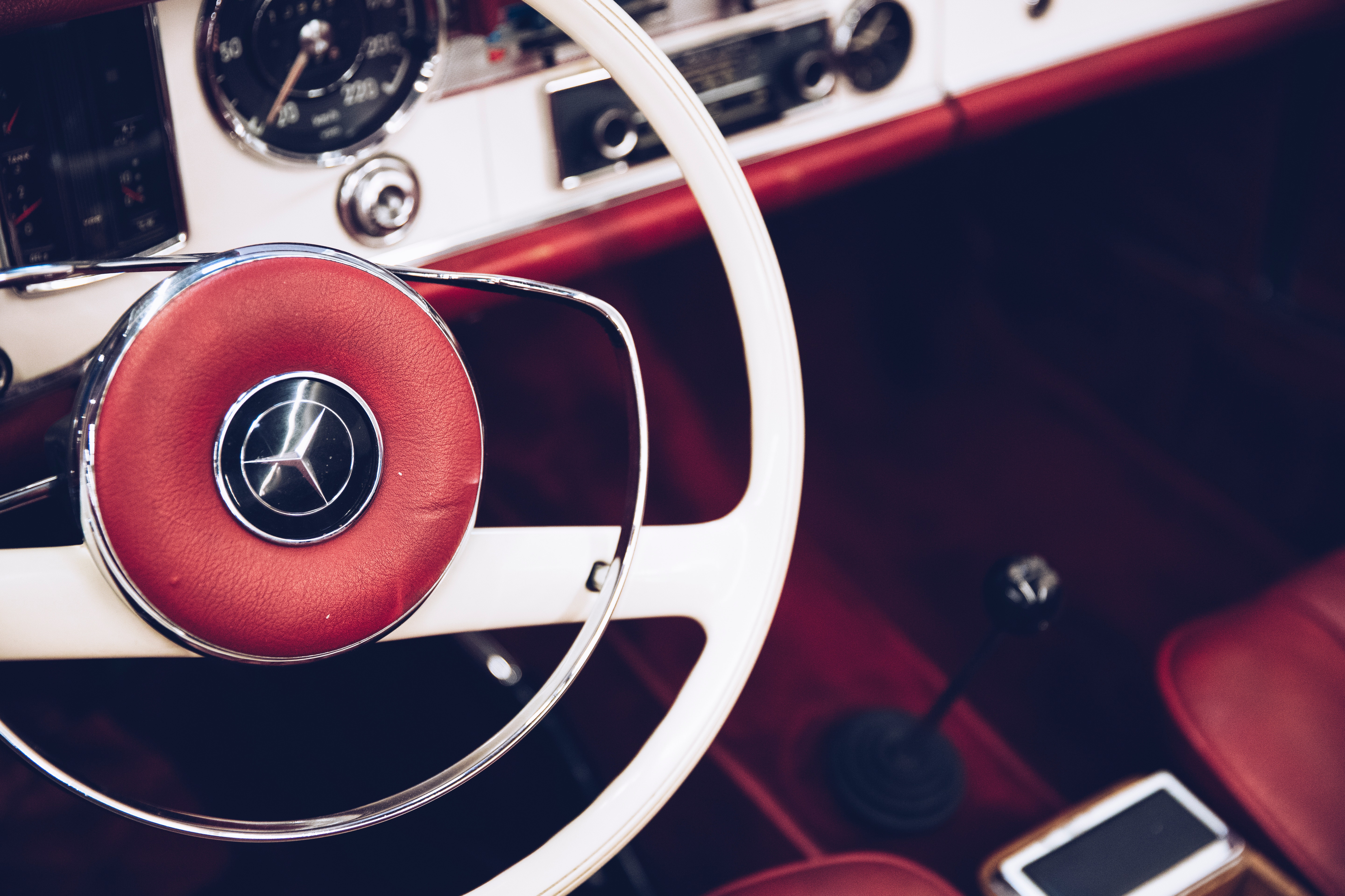 A white Mercedes-Benz steering wheel