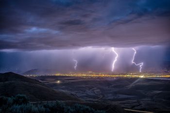 Lightning strikes over a city