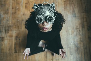Photo of a sitting person wearing a Steampunk mask