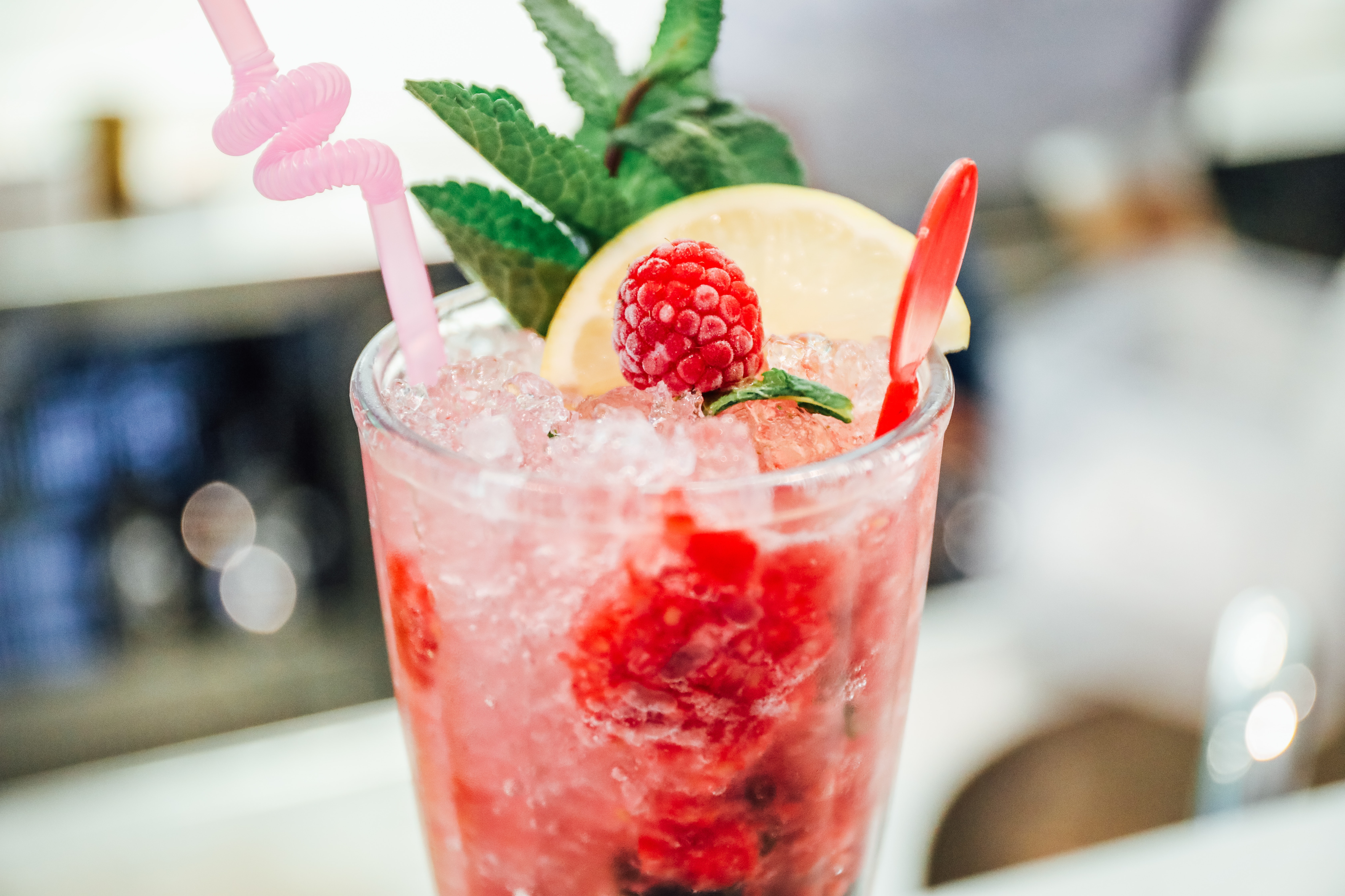 Selective focus photography of raspberry cocktail