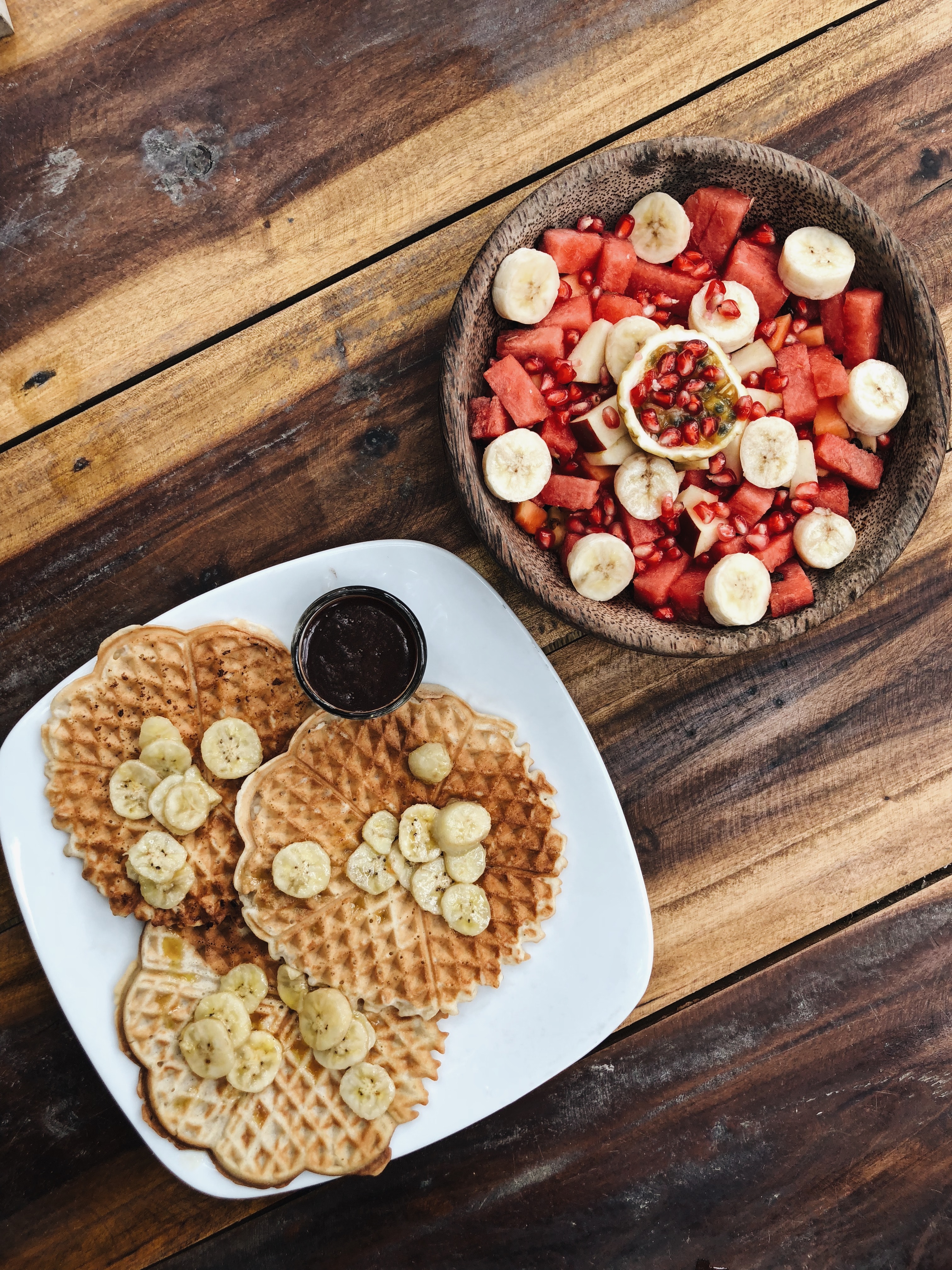 Flat lay of waffles and fruit salad