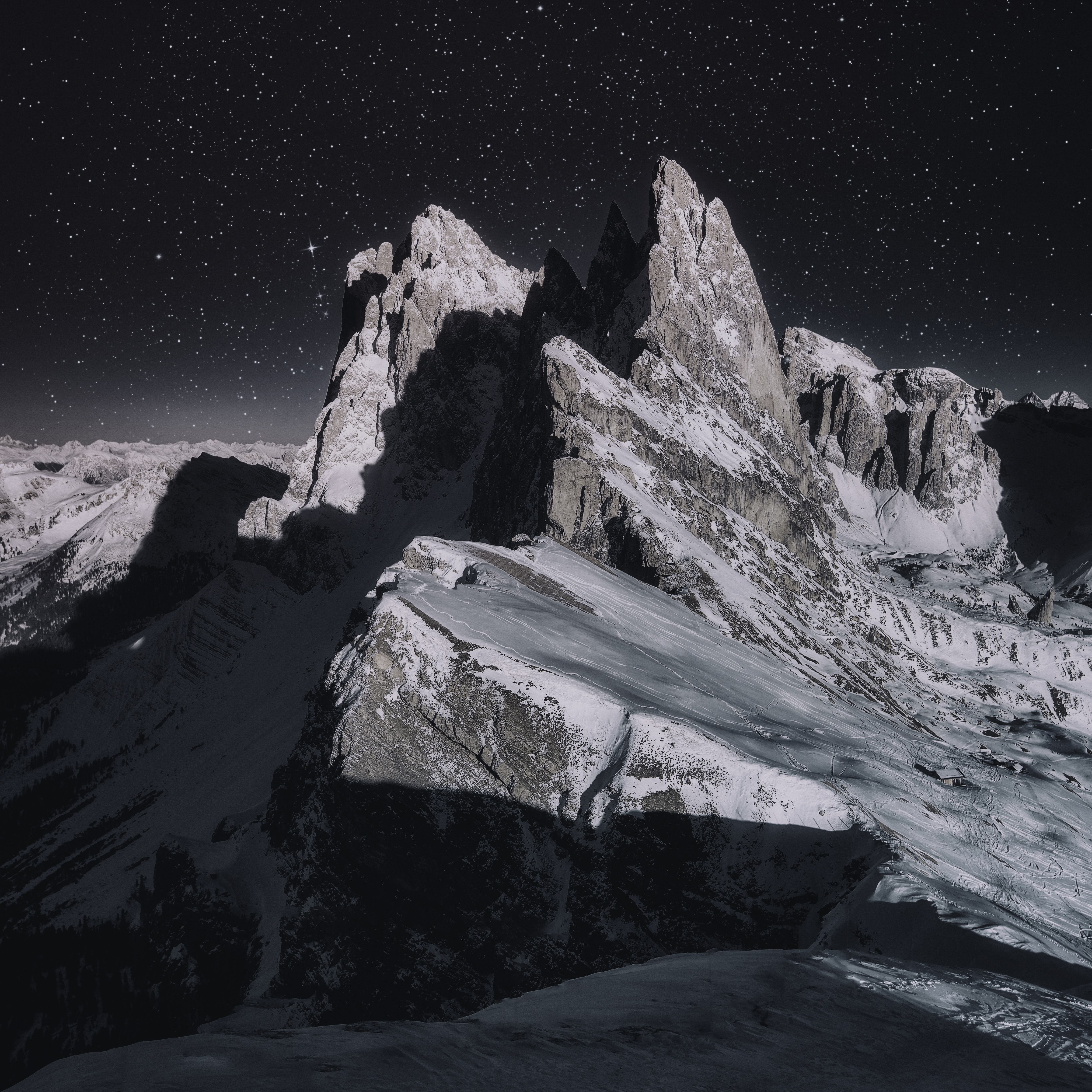 Photo of a snow-capped mountain during the night